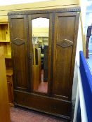 Polished wood glazed single door wardrobe with base cupboard