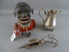 Painted Dinah cast metal moneybox, a pair of vintage candle snuffers etc