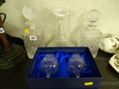 Glass ship's style decanter and two others and a pair of Bohemia crystal boxed brandy glasses