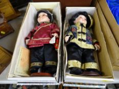 Two boxed porcelain headed dolls from the Leonardo Collection titled 'Ming Lee' and 'Ming Lo' with