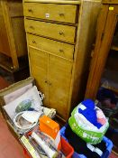 Slim wooden unit having three top drawers over two base cupboards with haberdashery and further