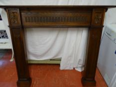Dark wood carved fire surround