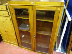 Glazed two door, four shelf bookcase