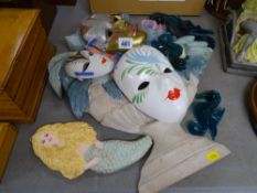 Painted carved wooden floral display, three wall masks and a quantity of undersea type ornamental