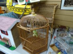 Wooden birdcage and a wickerwork child's armchair
