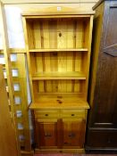 Small pine dresser with two base drawers over twin cupboard doors
