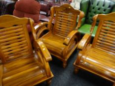 Three handcrafted Malaysian teak armchairs (matching previous lot)