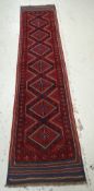 A Meshwari mainly blue & red coloured runner, 261 x 60cms