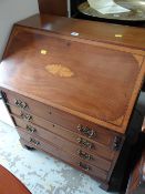 A neat compact mahogany & inlaid decorated drop front bureau
