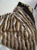 A vintage striped animal-style rug