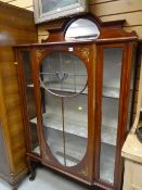 A good Edwardian mahogany & inlaid breakfront display cabinet with leaded glass decoration &