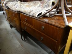 An Edwardian mahogany bedroom suite comprising two-door wardrobe, chest of drawers, mirrored