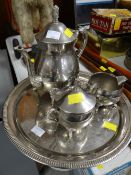 A three-piece EPNS teaset on a circular tray