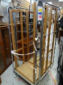 Two metal transport cages on wheels (outside)