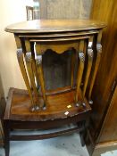 Nest of three tables together with a bow top mahogany stool