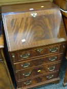 A reproduction mahogany small drop down bureau