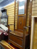 A vintage oak mirror backed hall stand