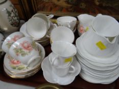 Vintage Shelley teaware together with Duchess Peach Rose patterned teaware