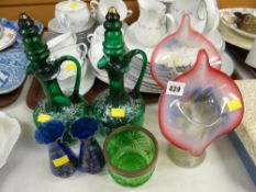 A pair of green glass lidded jugs, pair of Vaseline glass, orchid form vases etc