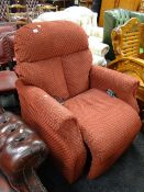 A modern red upholstered electric reclining armchair E/T