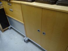 Two modern lightwood office cupboards together with two oak tub-style chairs