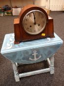 A vintage oak mantel clock together with a painted oak drop leaf side table