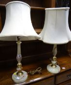 A pair of onyx & brass effect table lamps