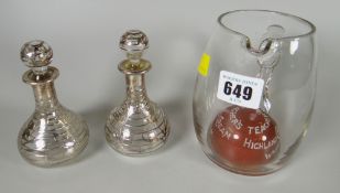 A vintage Teacher's whisky Highland Cream jug & two silver overlaid decorated scent bottles