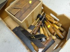 A box of various vintage woodworking tools including chisels, set squares, old moul planes etc