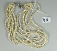 Ladies' six-string collar of pearls of varying shape to include spheres etc