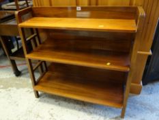 A vintage light oak waterfall bookcase