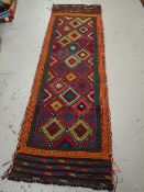 A Suzni Killim multi-coloured runner, 240 x 75cms
