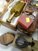 A boxed brass compass together with two leather cased military campuses, vintage camera etc