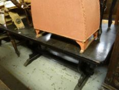 A dark oak refectory-style dining table