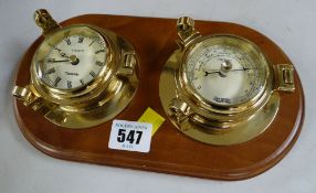 A modern wall mounted barometer / clock set