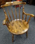 A modern believed oak spindle back Windsor-style armchair