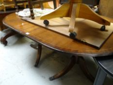 A reproduction mahogany Georgian-style extending dining table