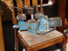A vintage bench vice together with a vintage Browns Iron Mongers of Cardiff oil can