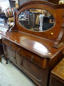 Mid-twentieth century mahogany mirror back sideboard, two-drawers above a two-cupboard base & on