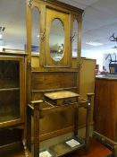 A vintage oak mirror back hall stand