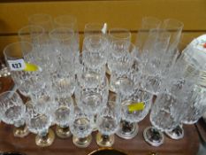 A tray of various matching drinking glasses