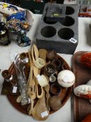 A slate wine bottle holder, wooden napkin rings, serving spoons, forks etc