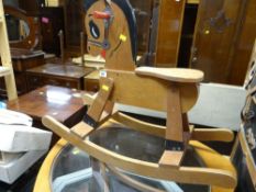 A vintage wooden child's toy rocking horse