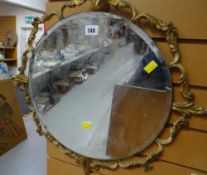 A vintage gilt framed circular mirror