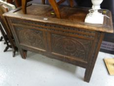 An antique small carved oak coffer