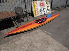 A canoe together with paddles & equipment etc