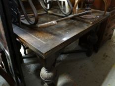 Vintage oak extending dining table on carved cross stretcher legs