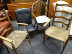 A pair of ladder back & rush seated kitchen armchairs together with a dark oak wheel back kitchen
