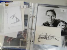 A folder of loose autographs & signed photographs including ROBERT STACK, PAUL DANIELS, BRUCE