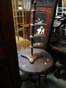 Shaped top occasional table together with a small four-shelf stand